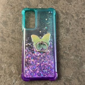 Galaxy Phone 6.75”x3” cover with glitter and butterfly floating inside.